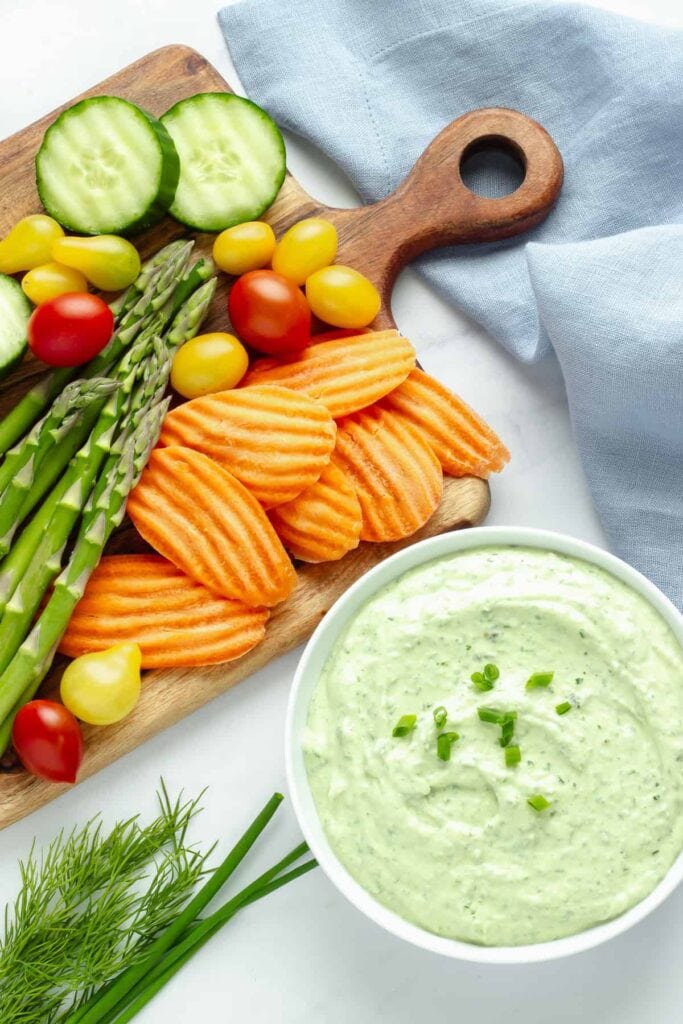 Green goddess fresh vegetable dip served in a bowl.