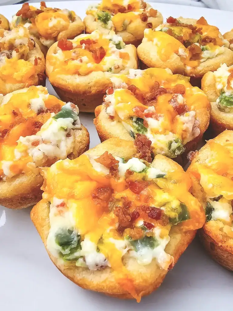 Jalapeño bacon crescent roll bites on a plate.