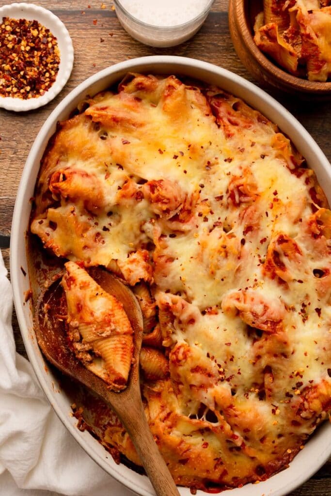 Lasagna stuffed shells in a baking dish.