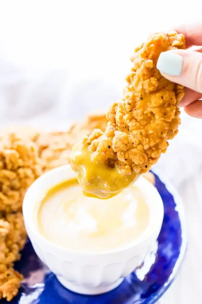 Chicken tender dipped in maple mustard sauce.