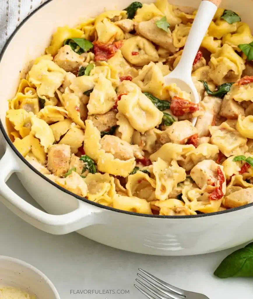 Creamy chicken and tortellini in a pot.