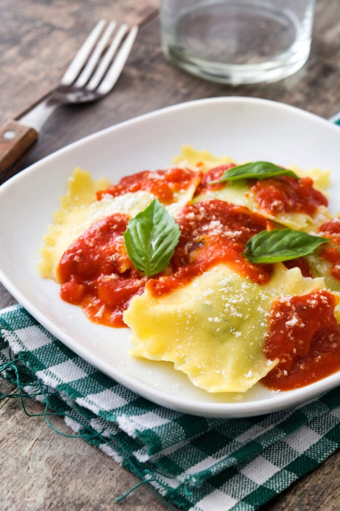 Ravioli with tomato sauce on a plate.