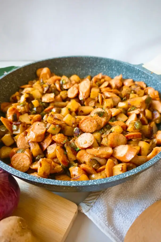 Cheesy chicken and rice casserole in a skillet.
