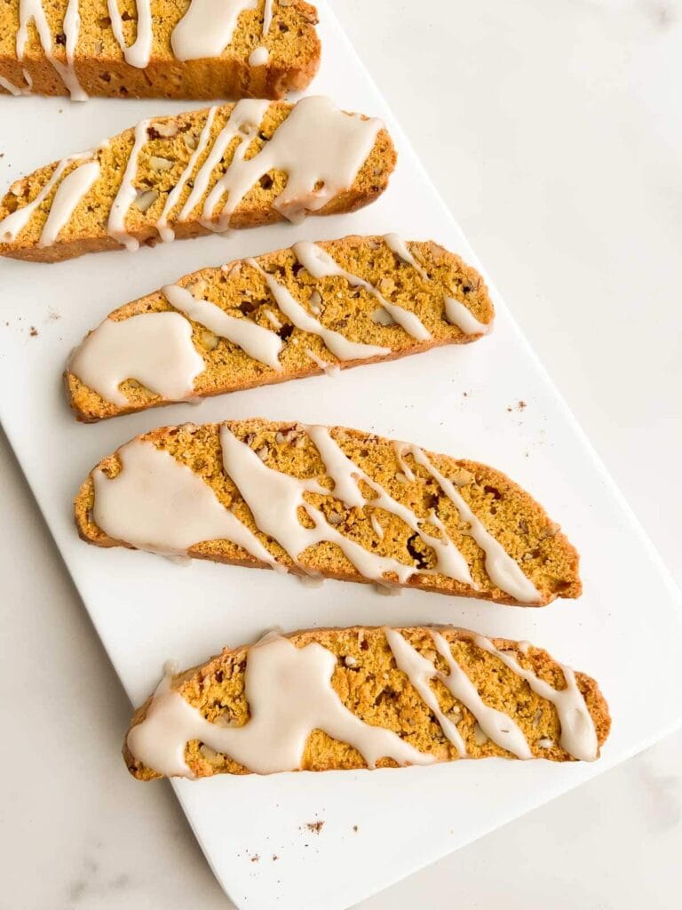 Pumpkin biscotti on a plate.