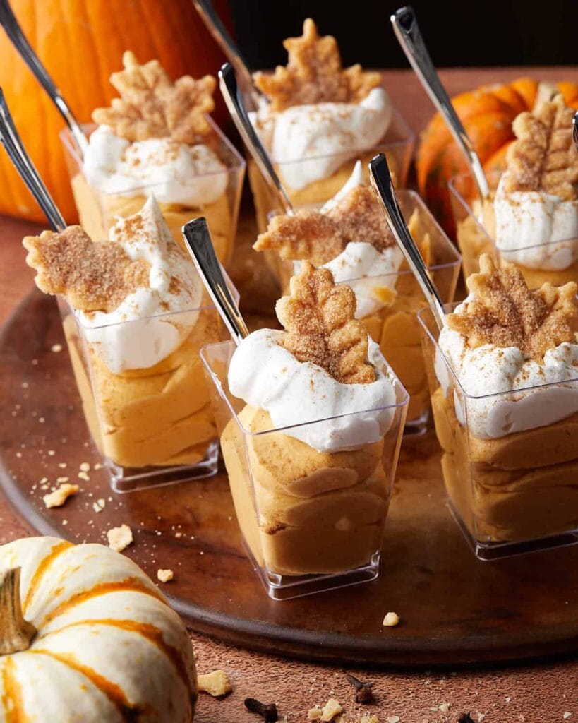 Pumpkin Pie in a Cup topped with whipped cream and pumpkin spice.