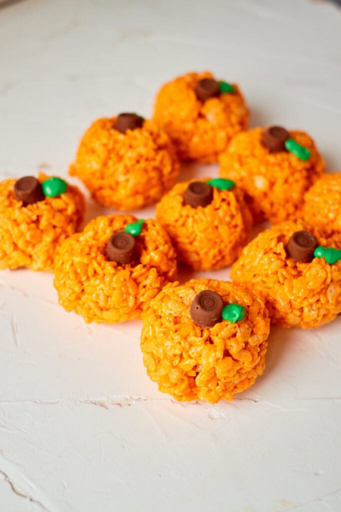 Pumpkin Rice Krispie treats on a plate.