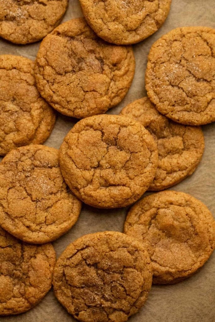 Pumpkin snickerdoodles on parchment paper.
