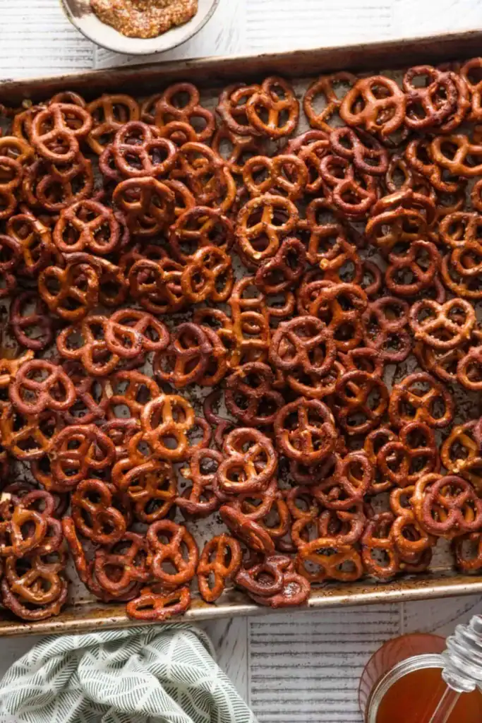 Crunchy honey mustard pretzels on a baking tray.