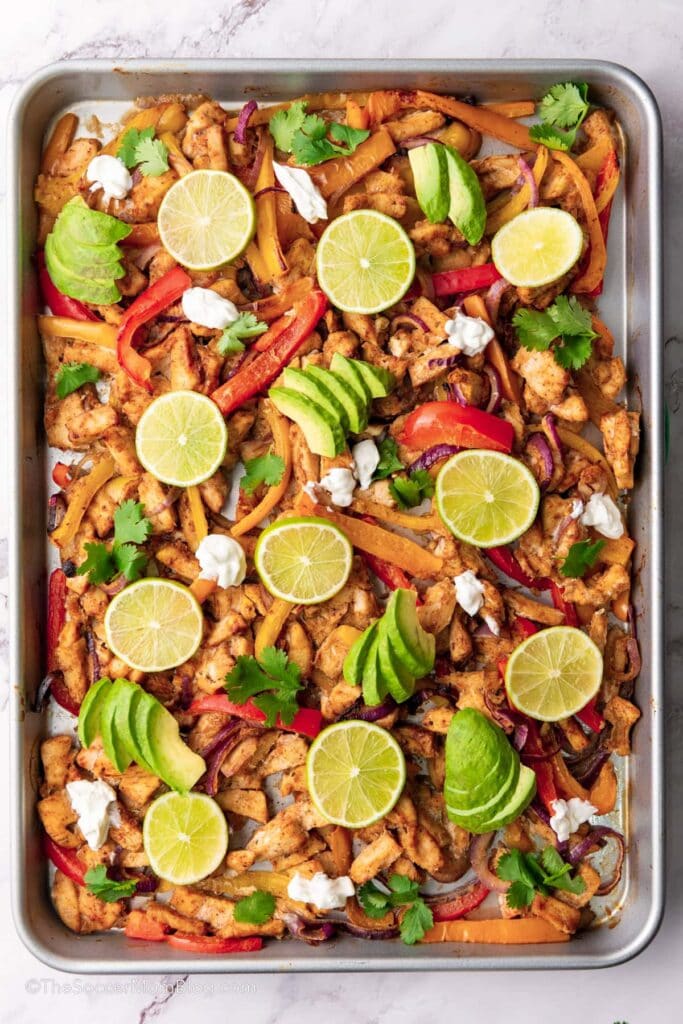 Chicken fajitas on a sheet pan.