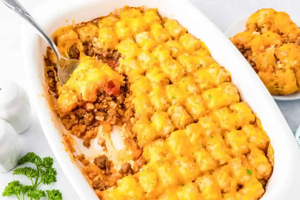Sloppy Joe tater tot casserole in a baking dish.