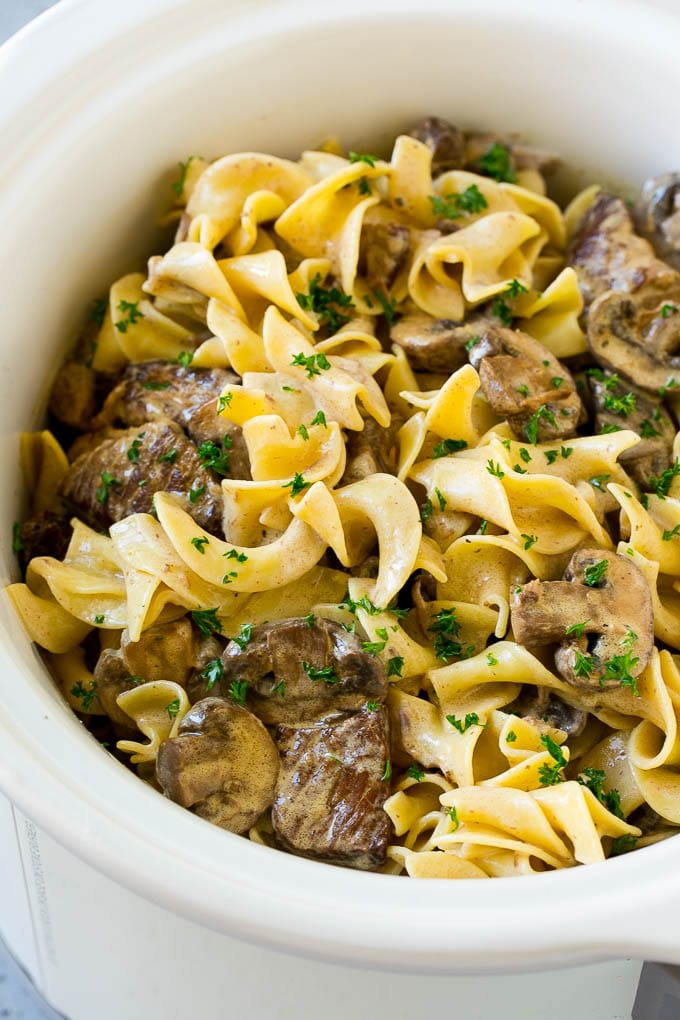 Slow cooker beef stroganoff in a crockpot.