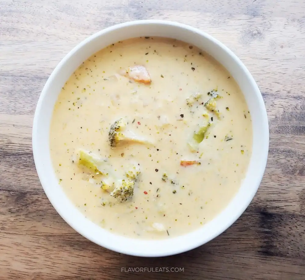 Slow cooker cheesy broccoli potato soup served in a bowl.