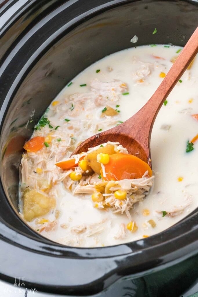 Chicken and corn soup in a slow cooker.
