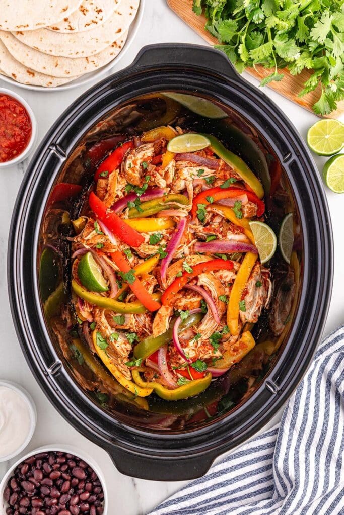 Chicken fajitas in a slow cooker.