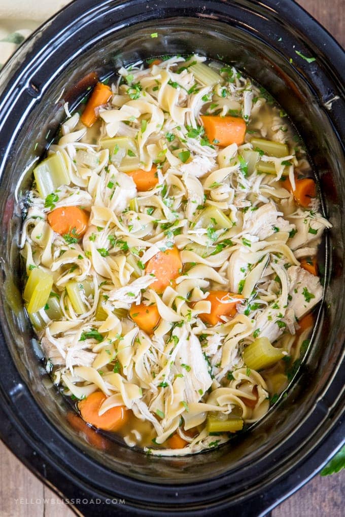 Chicken noodle soup in a slow cooker.