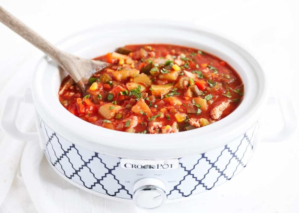 Chicken vegetable soup in a slow cooker.