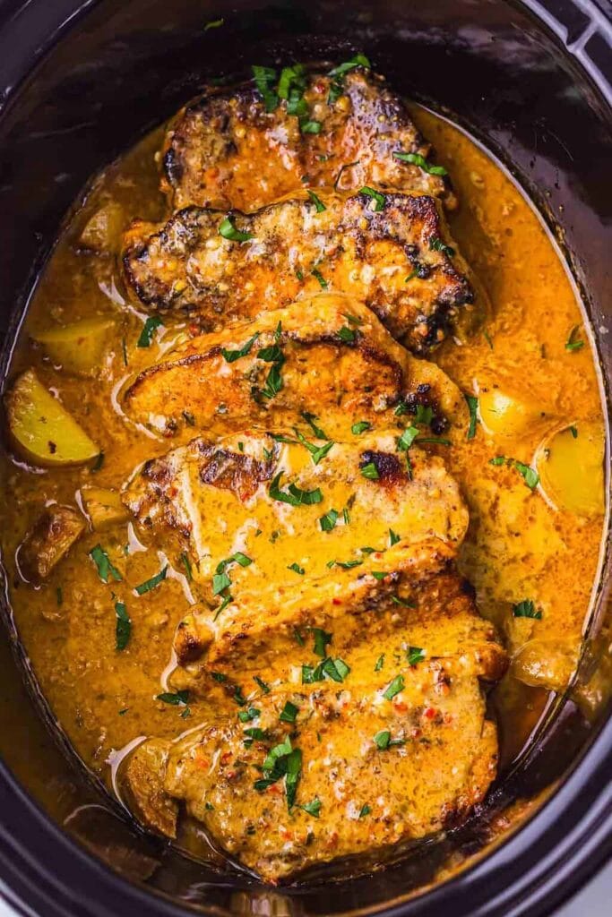 Garlic parmesan pork chops in a slow cooker.