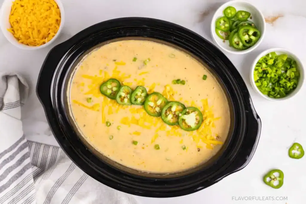 Jalapeño cheddar potato soup in a slow cooker.