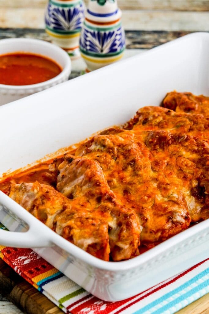 Slow cooker salsa pork chops in a baking dish.