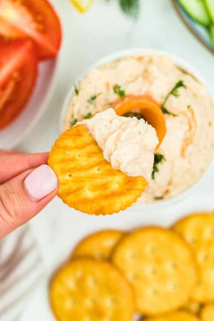 Smoked salmon dip on a cracker.
