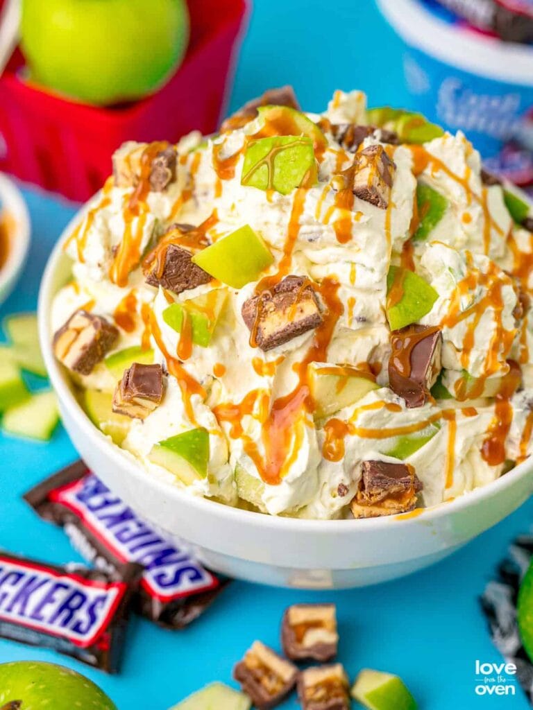 Snickers apple salad in a bowl.