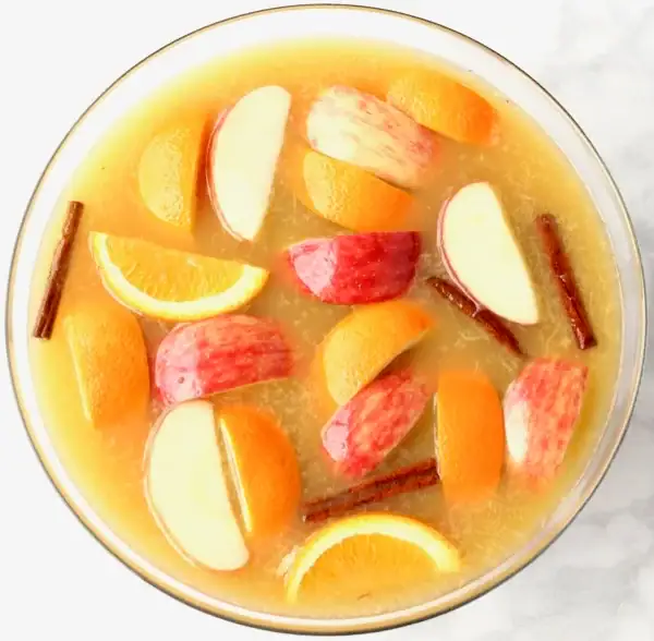 Sparkling apple cider punch in a punch bowl.