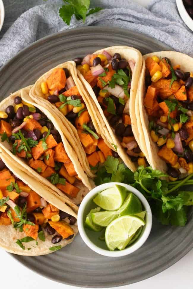 Sweet potato and black bean tacos served on a plate.