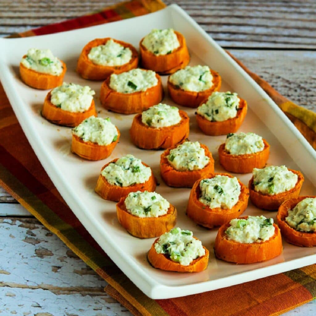 Sweet potato bites with feta on a plate.