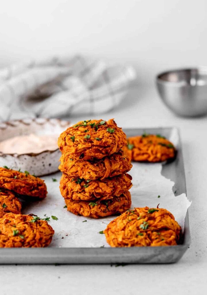 Sweet potato fritters on a sheet pan.