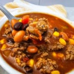 7 Can Taco Soup with Ground Beef served in a white bowl.