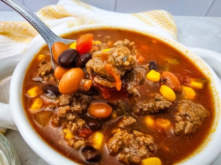 7 Can Taco Soup with Ground Beef served in a white bowl.