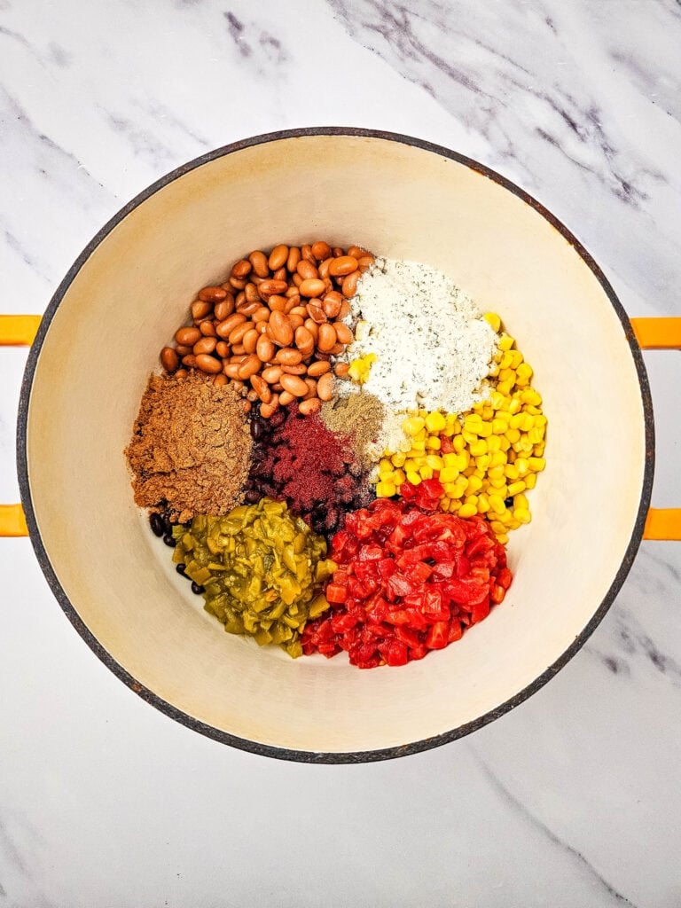Beans, corn, tomatoes, and green chiles in a pot