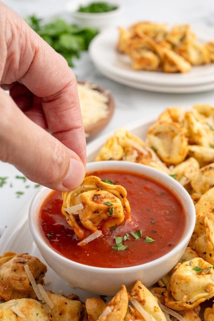 Air fryer tortellini with marinara sauce.