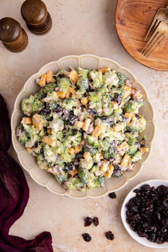 Broccoli salad with cranberries in a bowl.
