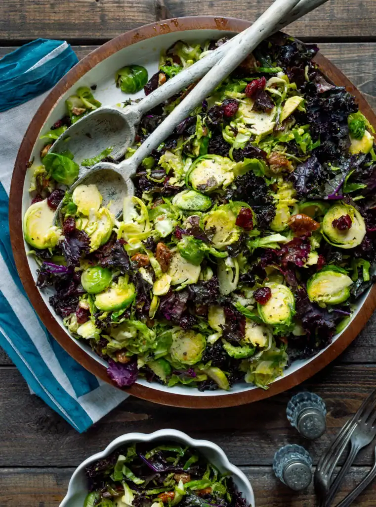 Brussels sprouts salad with maple vinaigrette in a bowl.