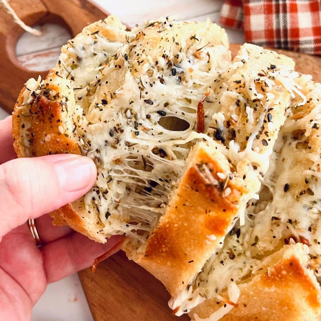 Cheese stuffed garlic bread with melted cheese.