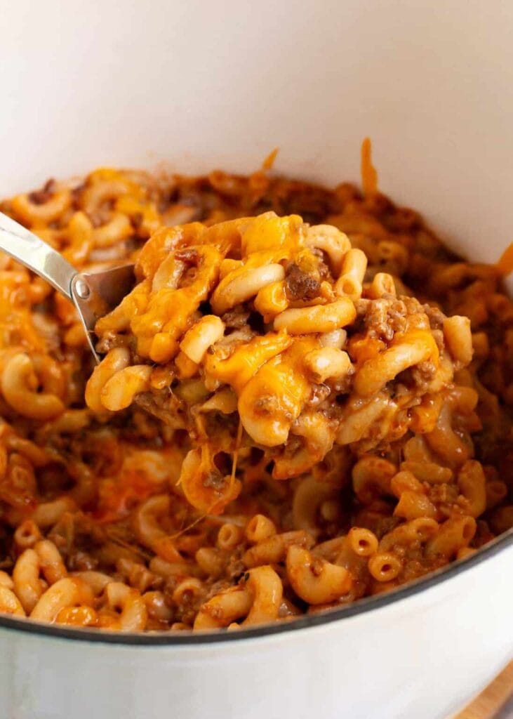 Cheeseburger casserole on a spoon.