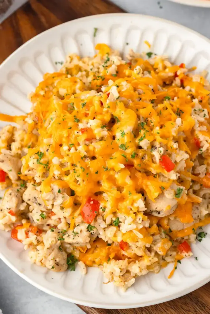 Cheesy chicken and rice casserole on a plate.