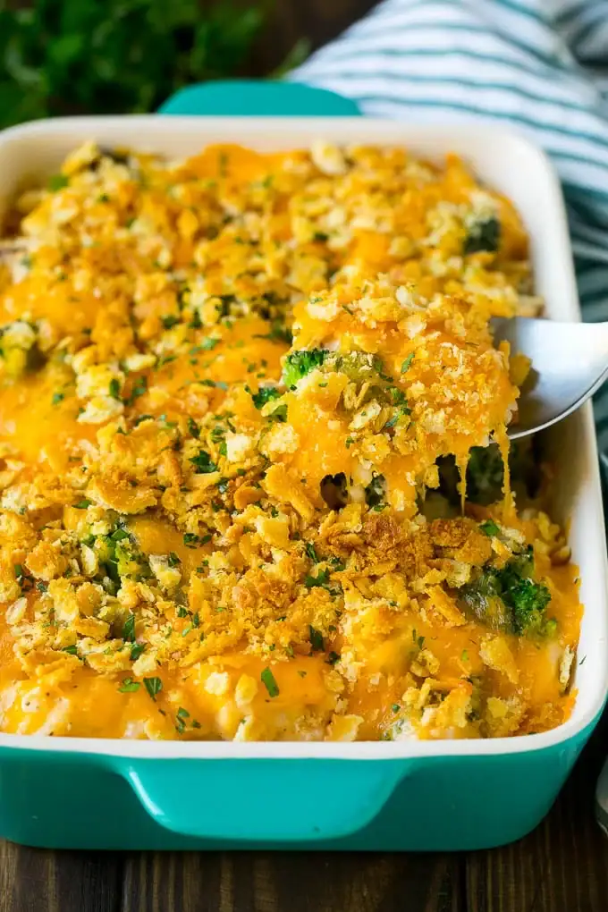 Chicken casserole with a creamy cheese sauce in a baking dish.