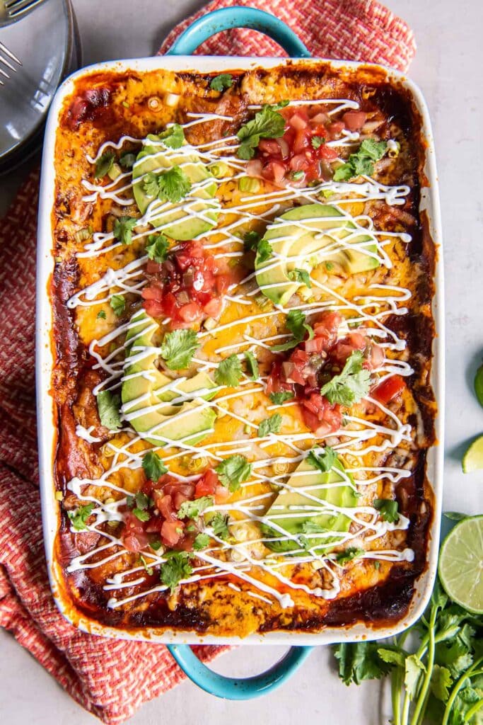 Chicken enchilada casserole in a baking dish.