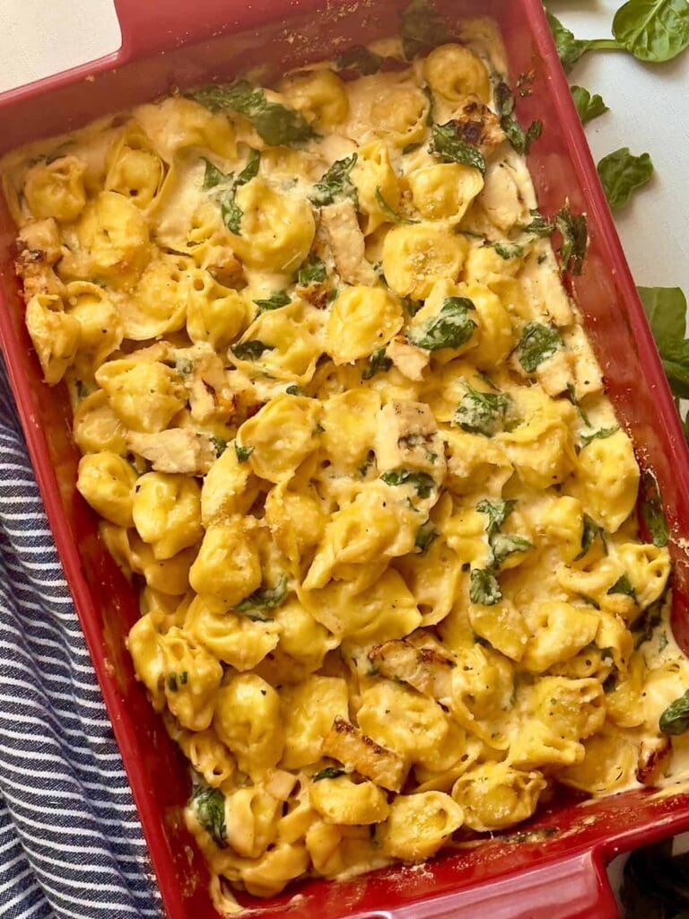 Top view of chicken tortellini casserole in a baking dish.