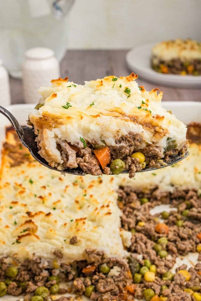 Cottage pie on a spoon.