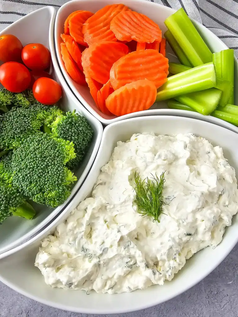 Cream cheese veggie dip with fresh vegetables.