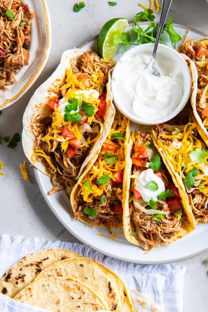 Crock-Pot chicken tacos on a plate.