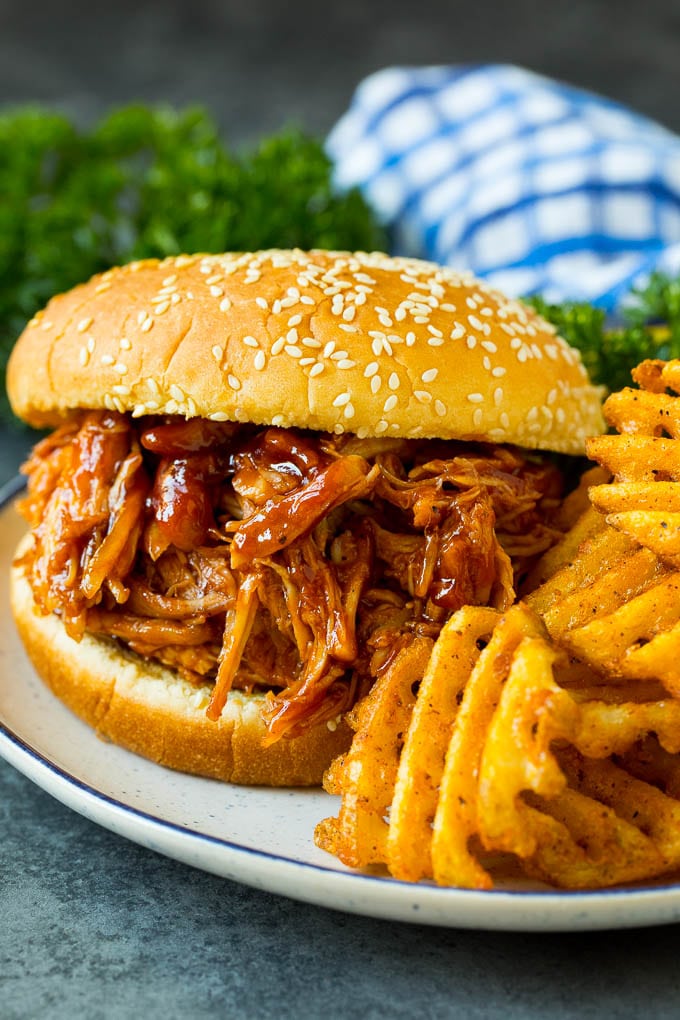 Crockpot BBQ chicken sandwich on a plate.
