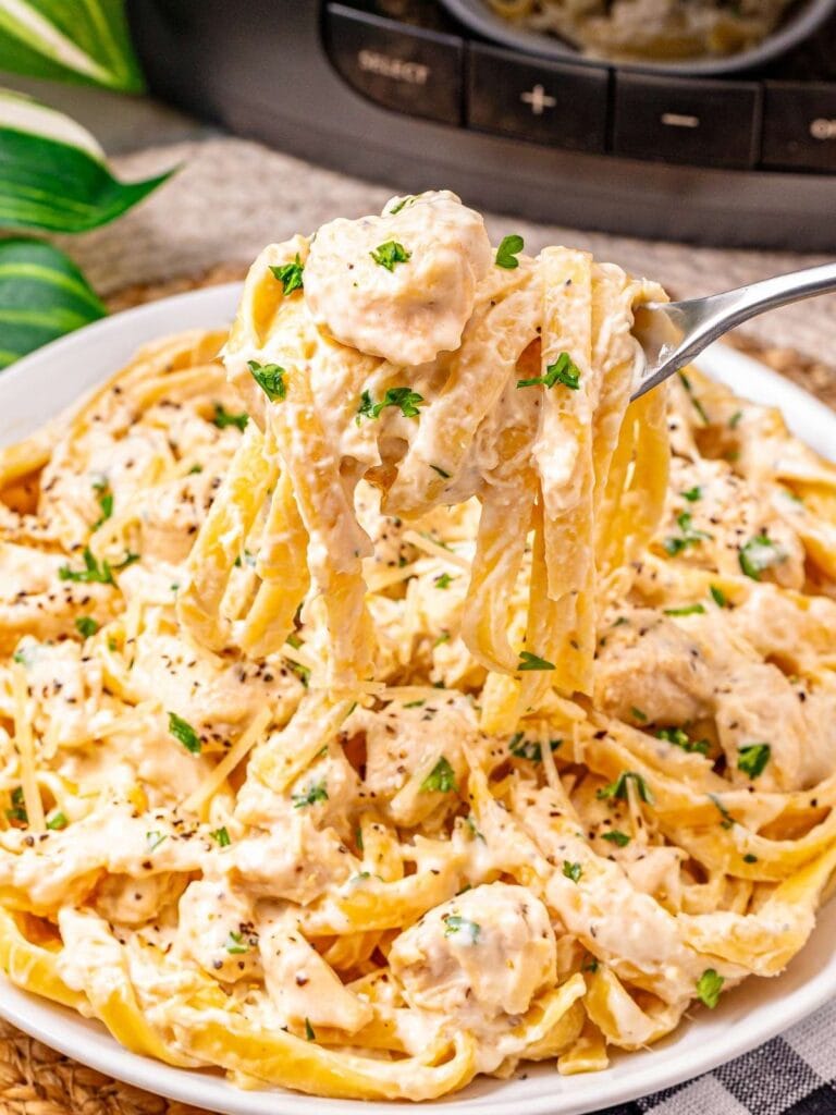 Crockpot chicken fettuccine Alfredo on a plate.