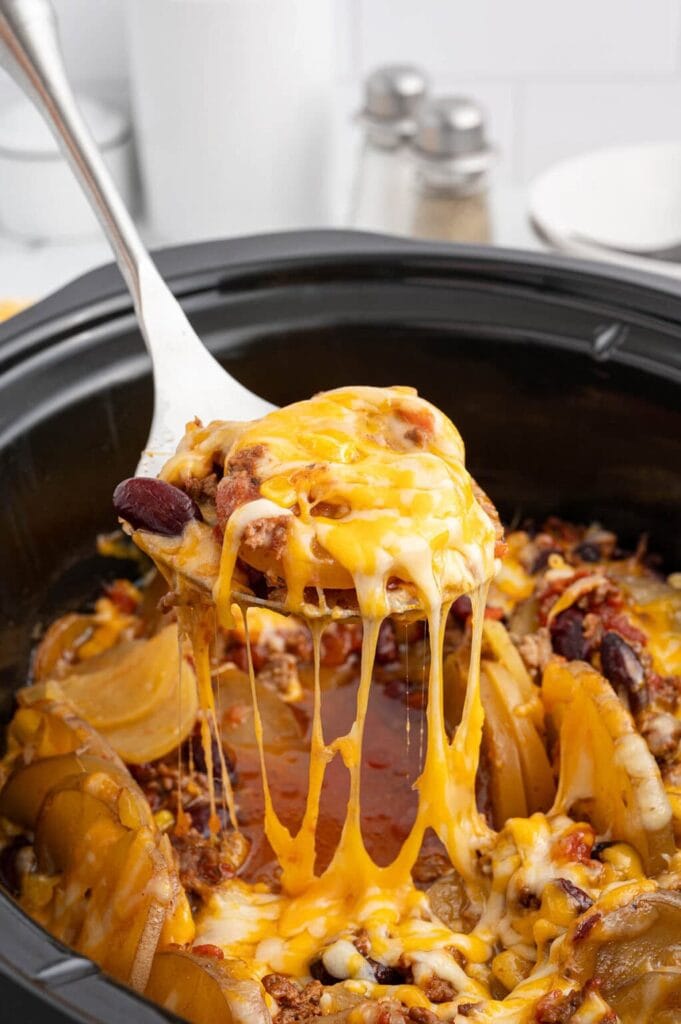 Crockpot cowboy casserole on a serving spoon.
