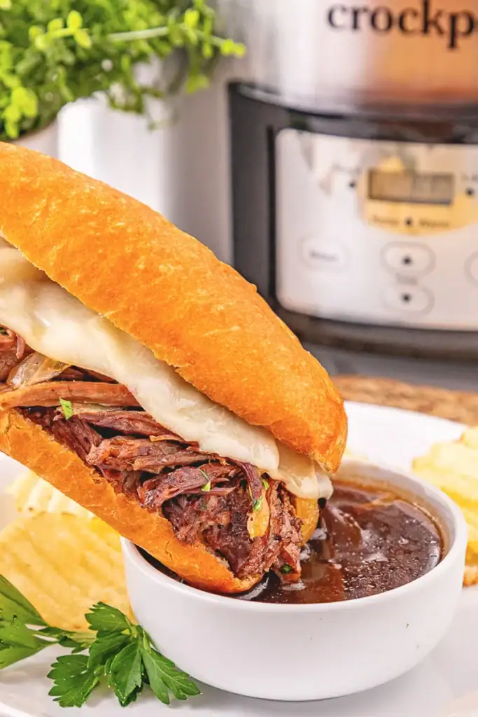 Crockpot French dip sandwich with au jus.