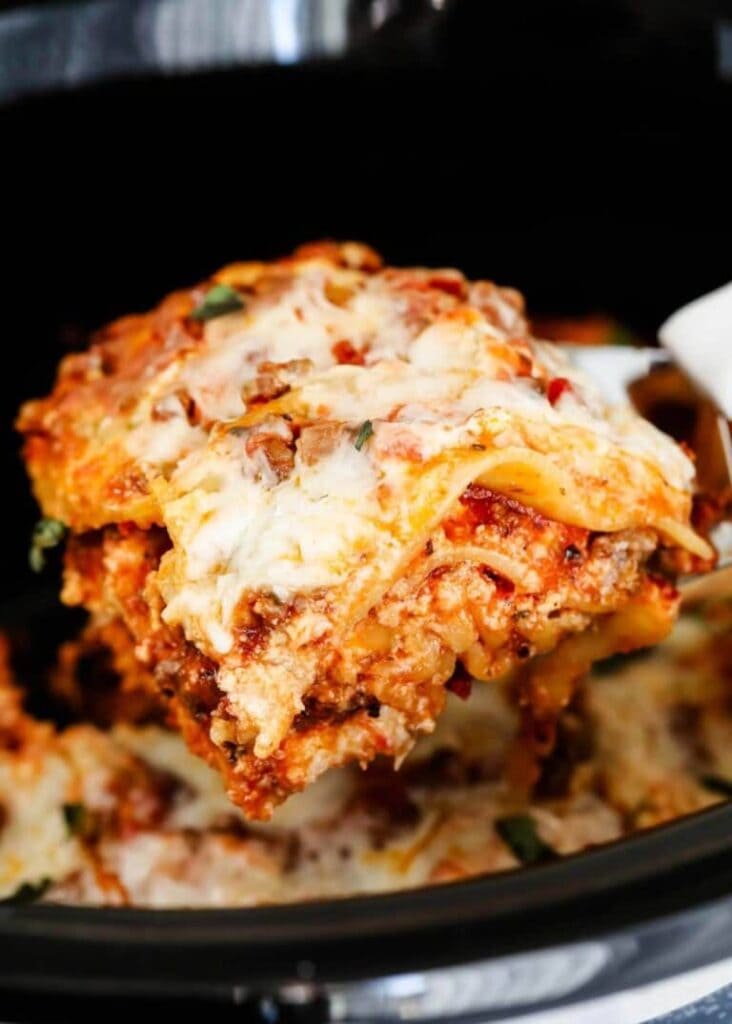 Close-up of crockpot lasagna on a spoon.