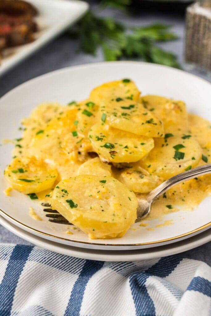 Crockpot scalloped potatoes on a plate.